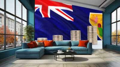 Turks And Caicos Islands flag waving in the background with rows of coins for finance and business concept. Saving money. Wall mural