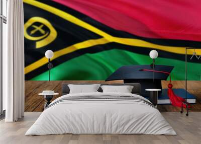 Vanuatu education concept. Graduation cap and diploma on wooden table, national flag background. Succesful student. Wall mural