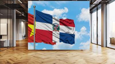 Vietnam and Dominican Republic flag waving in the wind against white cloudy blue sky together. Diplomacy concept, international relations. Wall mural