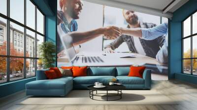 Business partnership handshake concept.Photo two coworkers handshaking process.Successful deal after great meeting.Horizontal, blurred background. Wall mural