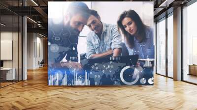 Coworking process in a sunny office.Young Business team making great solution at meeting room.Concept of digital diagram,graph interfaces,virtual screen,connections icon on blurred background. Wall mural