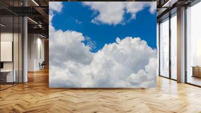 Blue sky with white clouds background Wall mural