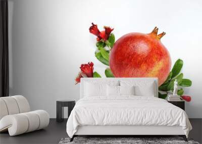 ripe pomegranate with pomegranate flowers and leaves on a light background Wall mural