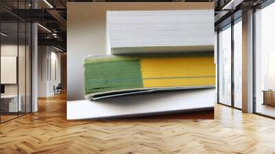 Books, Thick heavy books with white paper and hard cover, good binding, perfect binding, large number of pages, huge page booklet on table Wall mural