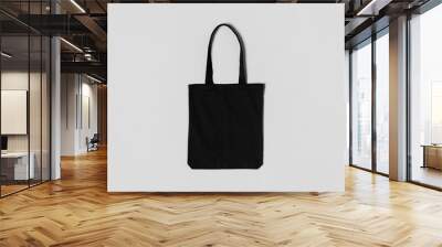 Black tote bag mockup on a grey background. Wall mural