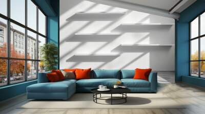 Five shelves mounted on the wall, casting light and shadow in an empty white room. Wall mural