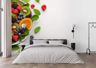 Fresh salad with fruits and greens on white background top view with space for text. Healthy food Wall mural