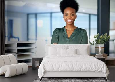 Always taking care of my business. Shot of a young businesswoman standing in an office at work. Wall mural