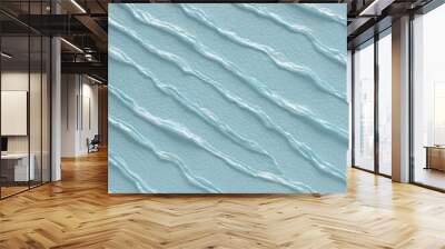 Close-up view of a textured surface with a consistent pattern. The surface appears to be a light blue color, with a slightly rough and uneven texture that resembles ripples or waves. Wall mural