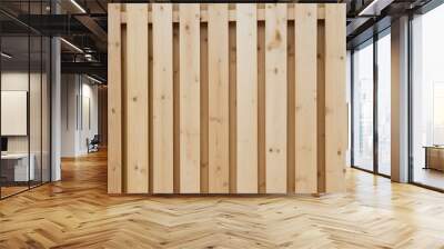 close-up view of a wooden fence. The fence is composed of vertical wooden planks that are light brown in color with visible wood grain and knots Wall mural