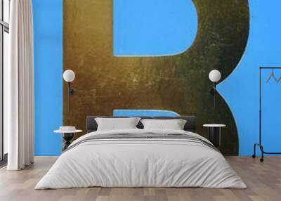 Letter B uppercase - golden color font on blue background, Close up Wall mural