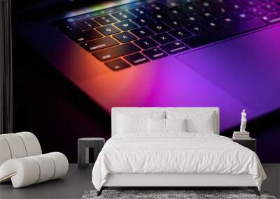 laptop with colourful glowing reflection Wall mural