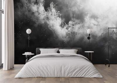 The dynamic spread of black chalk dust particles, vividly suspended in mid-air on a pure white canvas. Wall mural