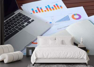 Business and Finances Concepts. Laptop, Notebook with graph and pen Wall mural