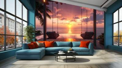 A sunset-lit wooden terrace with two suspended sofa chairs flanking a pool, offering a breathtaking view of the sea and palm trees.  Wall mural