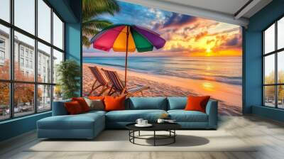 A tropical beach at sunset, showcasing white sand and gently swaying palm trees. Two beach chairs under a colorful umbrella sit on the sand Wall mural