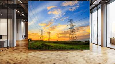 A high voltage of transmission tower in the morning sunrise with the beauty of a blue sky Wall mural