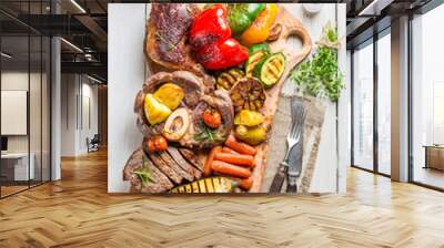 Grilled vegetables and steak with salt on wooden board Wall mural