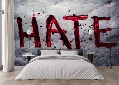 The word hate painted by blood on a metal table Wall mural