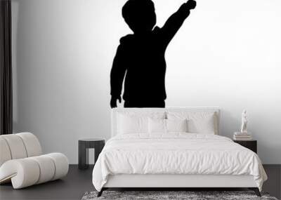 Black silhouette of little boy pointing to sky. Kid in winter clothes. Vector illustration Wall mural