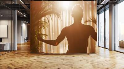 Man Standing in Front of Window With Arms Open Wall mural