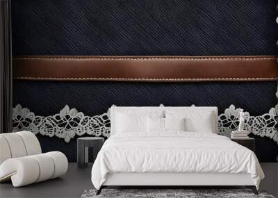 black denim background with lace borders and small leather label dark grey denim jeans fabric textu  Wall mural