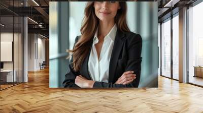 Confident Businesswoman in Modern Office Setting with Arms Crossed. Wall mural