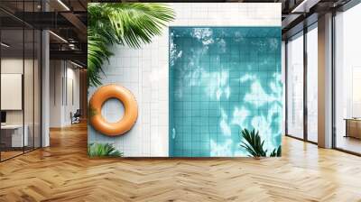 Aerial view of swimming pool with inflatable ring and tropical plants Wall mural