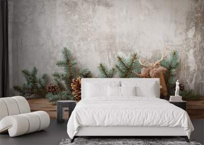 Christmas tree branches with cones on a dark wooden Board against a gray concrete wall. Wall mural