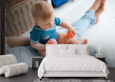 cute mother and child boy play together indoors at home Wall mural