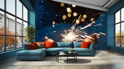 Sparkler in the snow in the evening. Wall mural