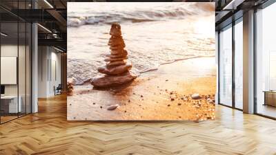 stones of the pyramid on the beach symbolize the concept of Zen, harmony, balance. Wall mural