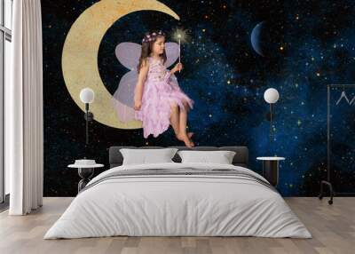 Fantasy little girl fairy sitting on moon creating nebula with magic wand, elements of this image furnished by NASA Wall mural