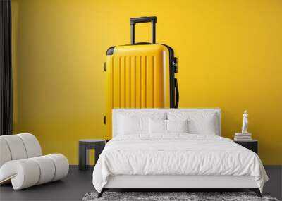 Yellow color suitcase isolated on yellow background. Wall mural