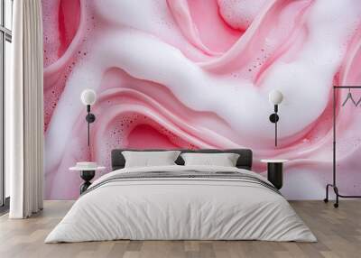   A close-up view of a pink and white liquid with texture consisting of many white and pink flecks Wall mural