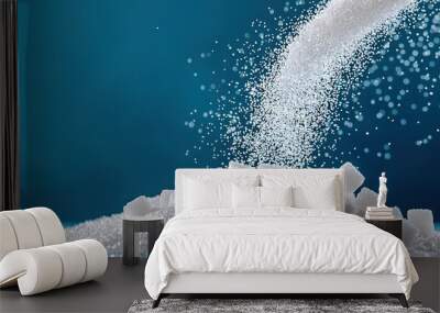   A mound of sugar dusted with sugar granules atop a stack of sugar cubes positioned on a tabletop Wall mural