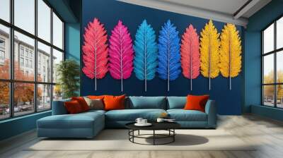   A row of colorful trees on a blue backdrop, featuring one tree centrally between two others in the line Wall mural