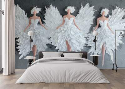   Three white-feathered mannequins on a gray and black backdrop, one in a white dress and the other in a white dress Wall mural