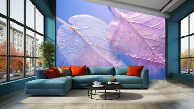  two leaf shaped objects sitting on top of a blue surface.  generative ai Wall mural