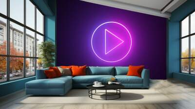 Neon purple glowing play button on black background. Play button icon with a glowing neon effect. Music play button icon Wall mural