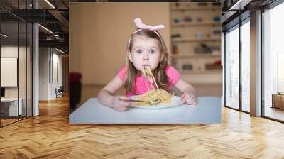 funny girl with spaghetti in her mouth Wall mural