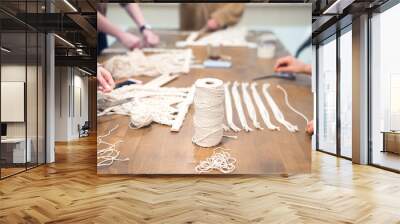 macrame workshop - woman weaving macrame panels for home decor Wall mural