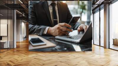 Businessman hand using mobile phone to connect digital wallet. Mobile banking, online finance, e-commerce, smart wallet, financial transactions, and economy management. Wall mural