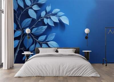 blue leaf branches are against a blue wall above a mirror with a light blue background Wall mural