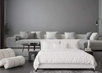 A modern, minimalist living room with a large, comfortable white sofa with plush pillows, set against a plain gray wall. Wall mural