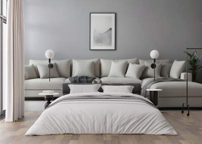 A modern, minimalist living room with a large, comfortable white sofa with plush pillows, set against a plain gray wall. Wall mural