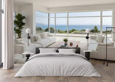 A modern, minimalist living room with large windows overlooking a scenic ocean view. The room features white sofas, a wooden coffee table, and potted plants. Wall mural