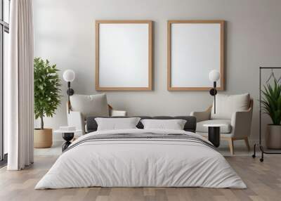 Two wooden framed blank canvases hanging on a white wall above two beige armchairs and a small wooden table. Wall mural