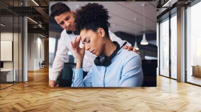 Burnout, call center and black woman with headache in office with colleague for help, comfort and support. Stress, girl and tired while consulting for crm, telemarketing and customer service online Wall mural