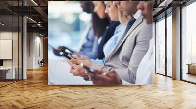 Hands, phone and hr with a group of people waiting in line for an interview or meeting. Mobile, hiring and recruitment with business collegues sitting in a human resources candidate shortlist row Wall mural